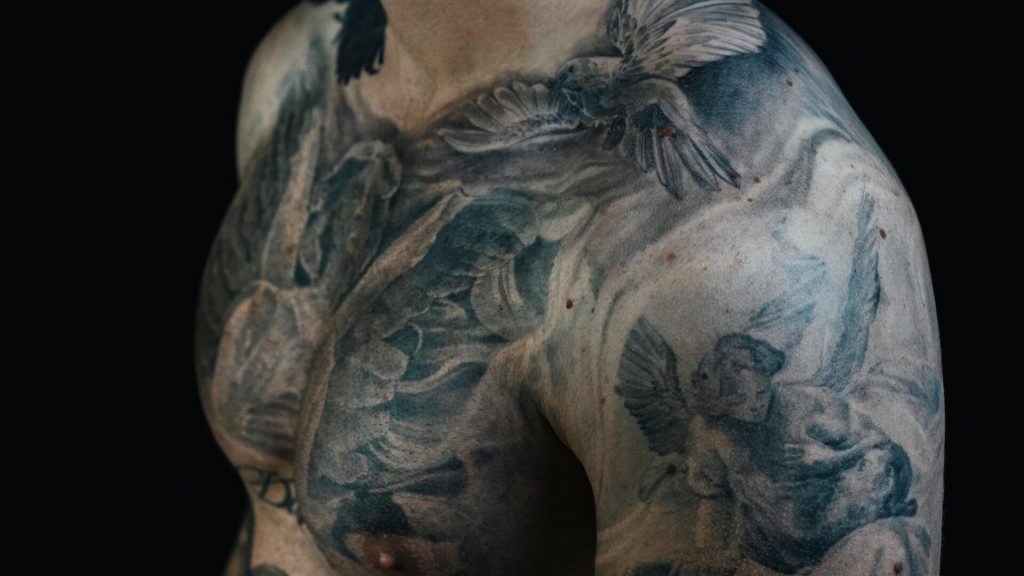 A tattoo rendered in shades of black and grey, offering depth and contrast without color.