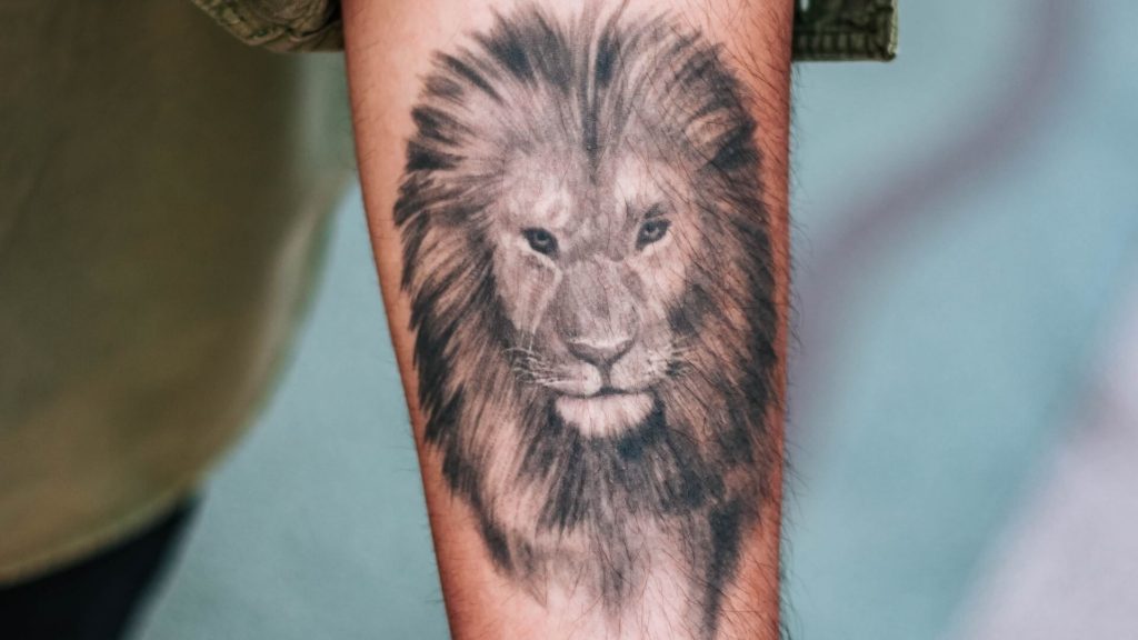 A tattoo designed to look highly realistic, often resembling a detailed photograph or portrait.